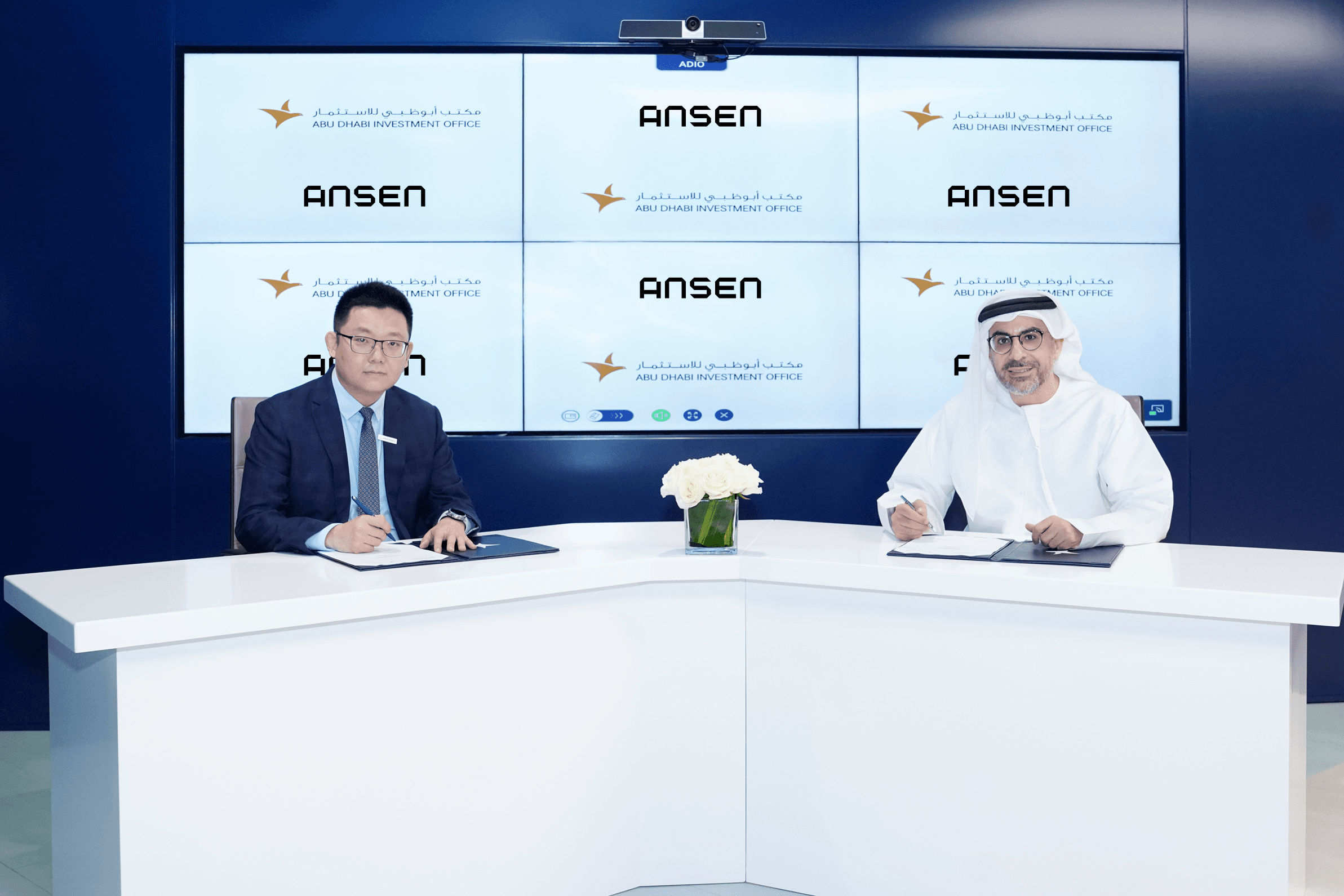 Ansen and Abu Dhabi Investment Office representatives signing a partnership agreement